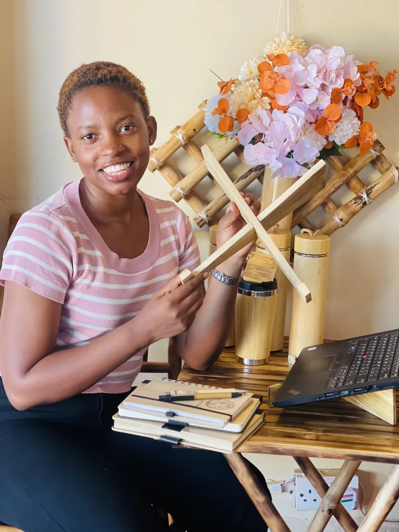 At the desk with bamboo products and flowers