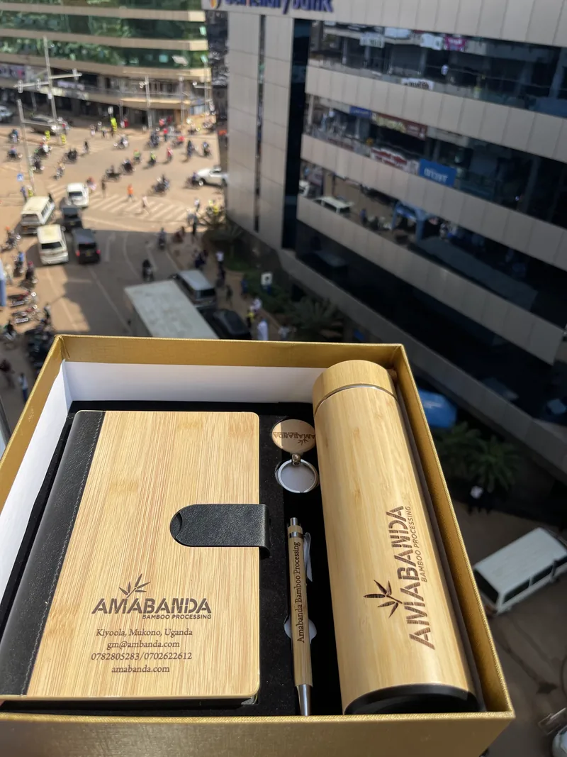 A boxed gift set: bamboo notebook, bottle and pen