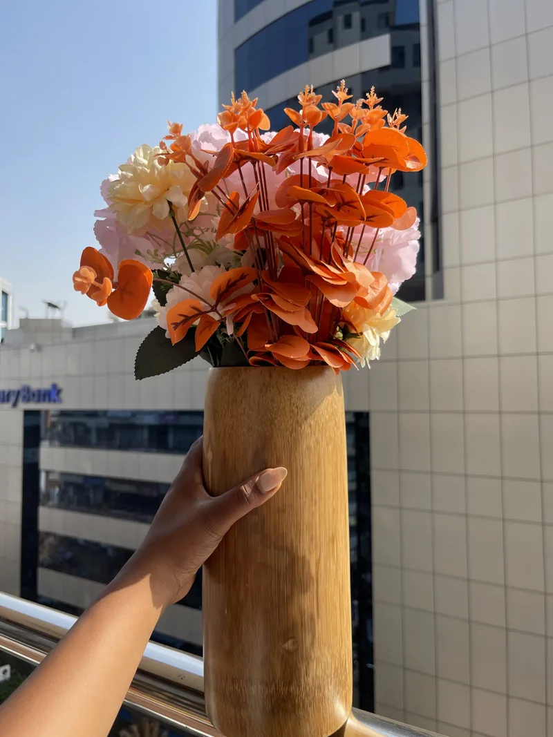 A bamboo vase holding flowers