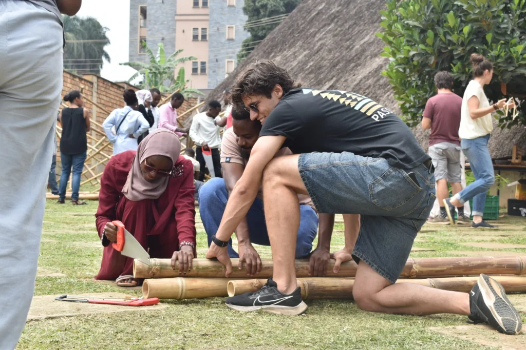 Sawing bamboo at a workshop on a lawn